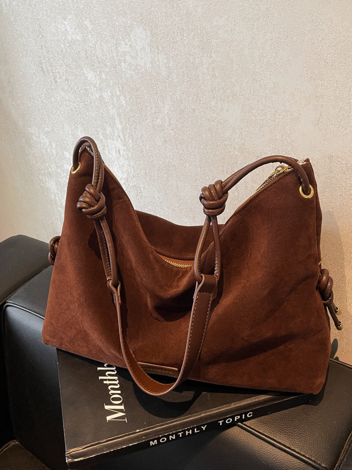 Grote suède handtas