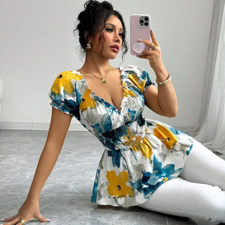 Damesblouse met plunging halslijn bloemenprint peplum snit - Yelina